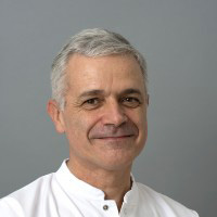 Dr. Roland DE VARAX